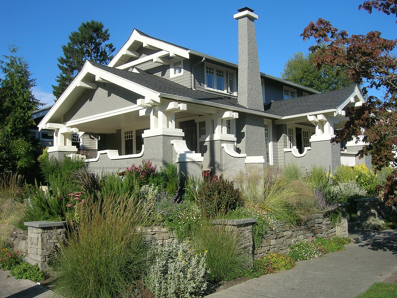 Craftsman bungalow with a stone garden wall in Wallingford, Seattle